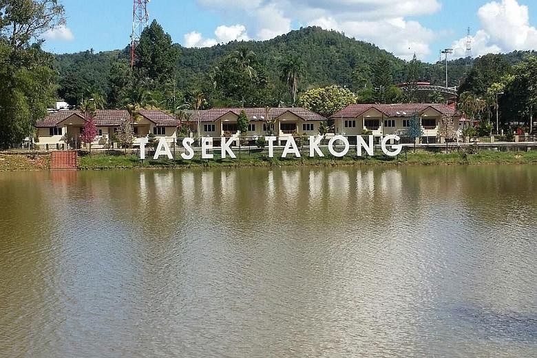 Man-made lake Tasek Takong, which is located near the Perak-Thai border, used to be popular with anglers and picnickers (left), but the lake has disappeared as the water has dried up during the prolonged hot and dry spell (right). The lake last dried