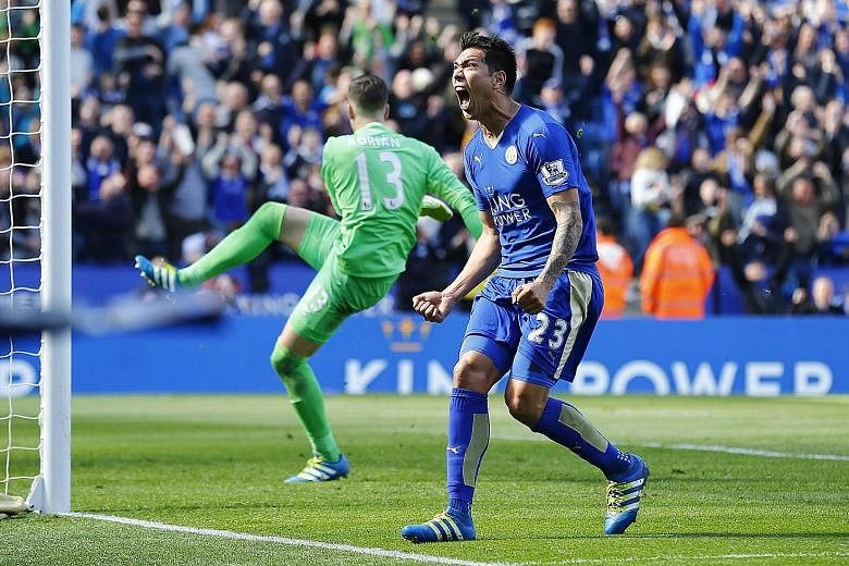 Leonardo Ulloa celebrating after scoring the last-gasp equaliser for Leicester from the penalty spot in the 2-2 draw against West Ham at the King Power Stadium yesterday.