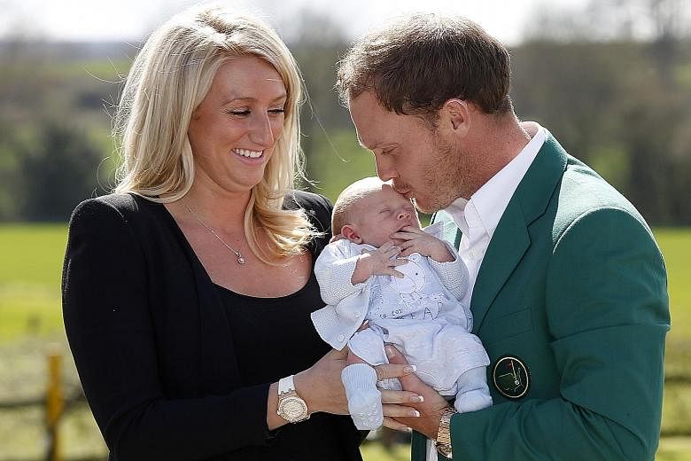 US Masters champion Danny Willett with his wife Nicole and two-week-old son Zachariah at Lindrick Golf Club in Yorkshire last week.