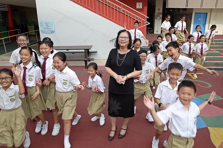 Madam Poh with her Primary 5 class at Yu Neng Primary School. She believes in being flexible in the approach she takes towards individual pupils as every child is different, with different needs. She once allowed a "problem child" to leave the classr