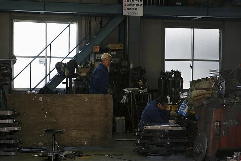 A metal processing factory in Tokyo. There is speculation that the Bank of Japan, which meets next week, will unveil more stimulus measures to boost the country's stalling growth.
