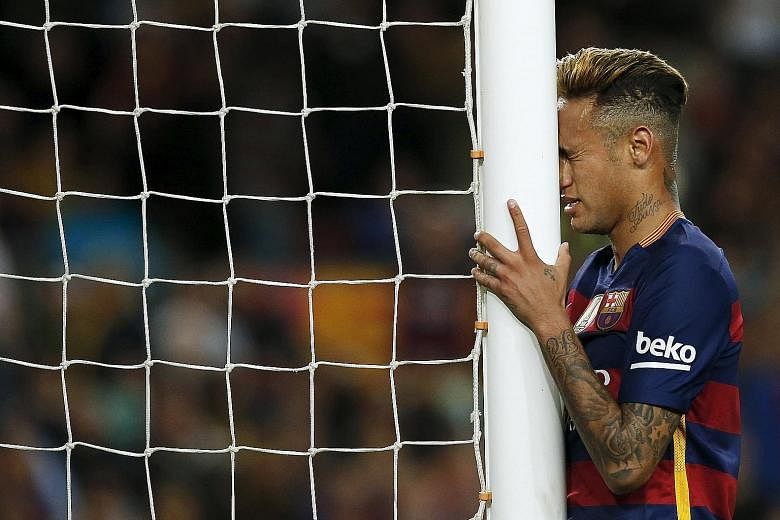 Neymar reacts after missing against Valencia, one of 22 attempts Barcelona had on goal in a match which they enjoyed 69 per cent possession. Still, the Spanish leaders can seal the title by winning their last five games.