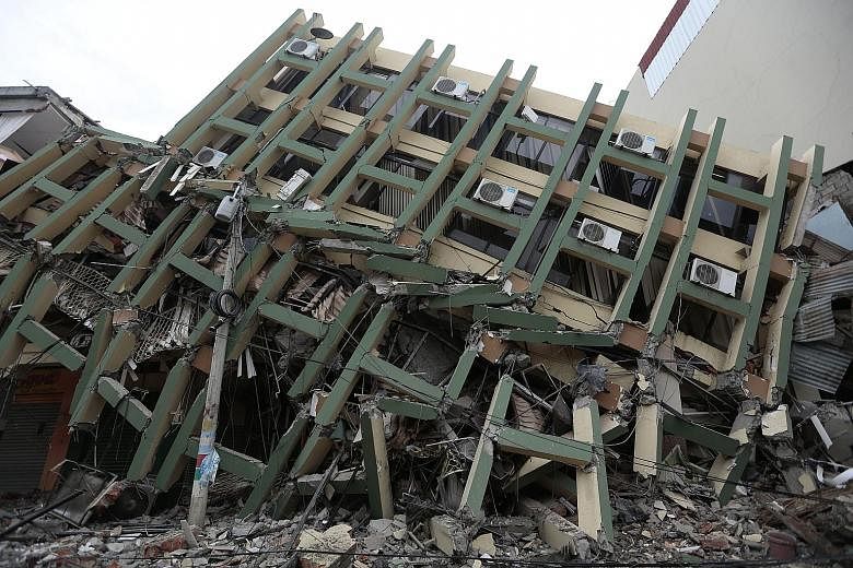 A collapsed building in Portoviejo city in Ecuador. The 7.8-magnitude quake on Saturday ripped apart buildings and roads and knocked out power in the largely poor country of 16 million people.