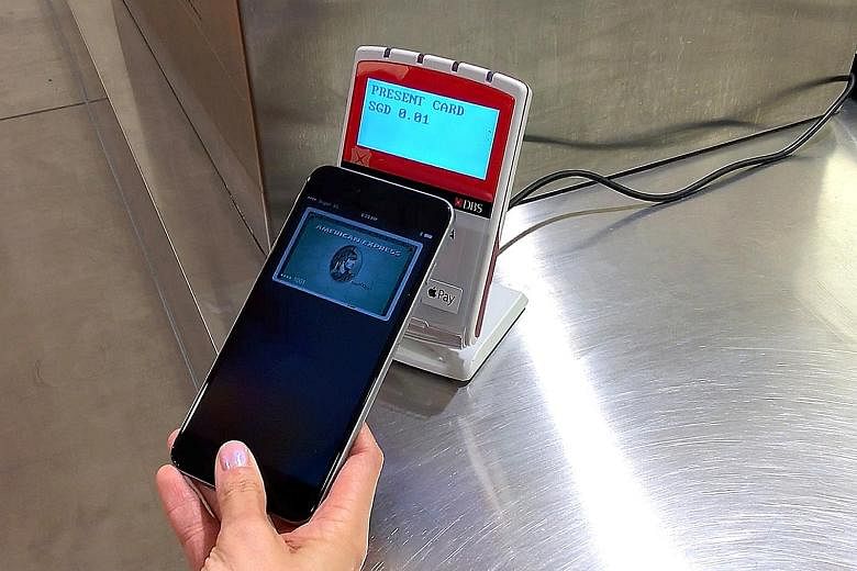With Apple Pay, users just need to tap their device, like this iPhone 6s Plus, on a supported NFC payment reader.