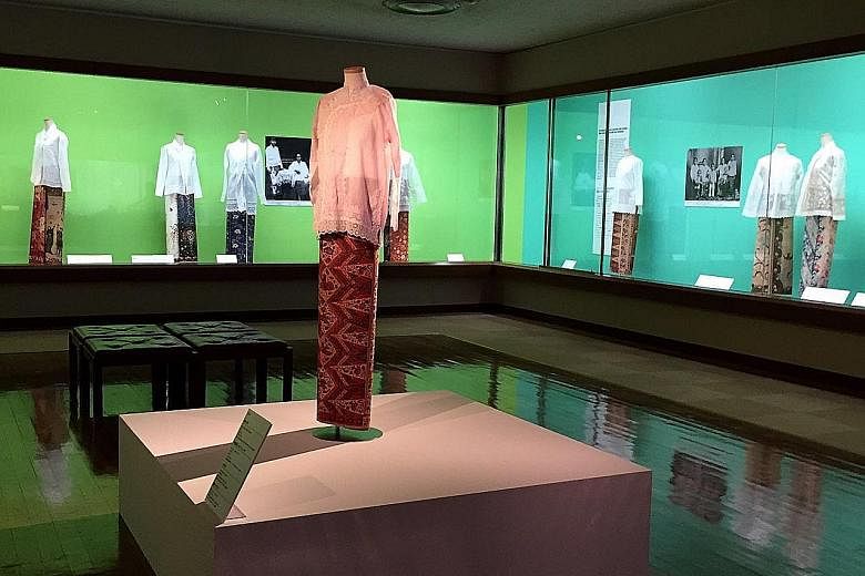 The blouse, or baju peki, on the platform is a gift from the family of Singapore's Mr Lee Kip Lee to the Fukuoka Art Museum and is part of its exhibition, Singapore, Sarong Kebaya And Style.