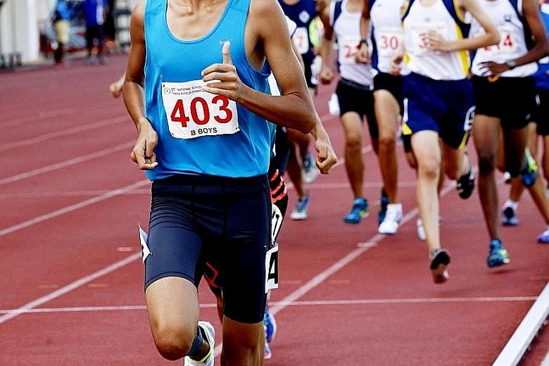 VJC's Nicole Low competing in the A Division 3,000m final yesterday at Bishan Stadium. Her time of 10min 57.61sec beat a record that had stood for 13 years. Right: Pasir Ris Secondary School's lone runner, Syed Hussein, who won the B Division cross-c