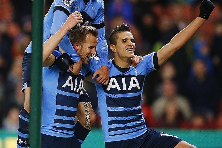 Tottenham's Dele Alli (clockwise from top) and Erik Lamela celebrate Harry Kane's strike, Spurs' third, in a 4-0 win over Stoke City at the Britannia Stadium.