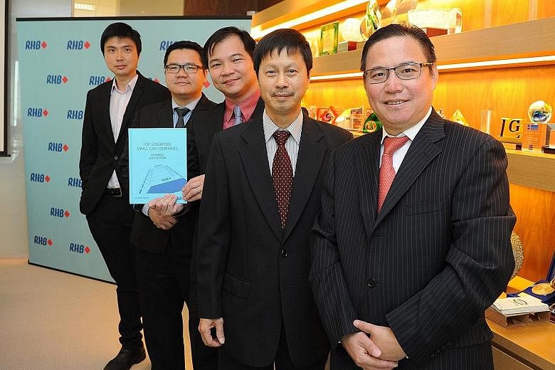 Among those at the handbook's launch yesterday were (from right) Mr Meng, China Aviation Oil CEO, Mr Hew, Fu Yu CEO, Mr Ong, RHB Research Singapore head, IPS Securex chief operating officer Brandon Lee and Mr Ng, Sinarmas Land executive director. Mr 