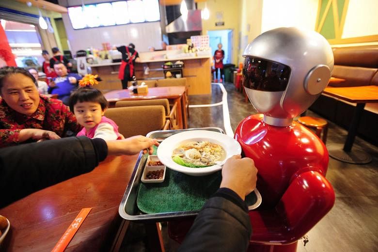 Little Flower, a robot, in a Shenyang restaurant. Several restaurants have stopped using robots for their inability to perform tasks such as handling soup dishes, but Little Flower seems to be managing quite well .