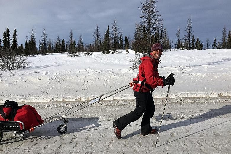 Mr Toh taking the freezing temperatures - which were as low as minus 40 deg C - in stride during the 6633 Arctic ultra race last month. He came in second in the 566km race across Canada.