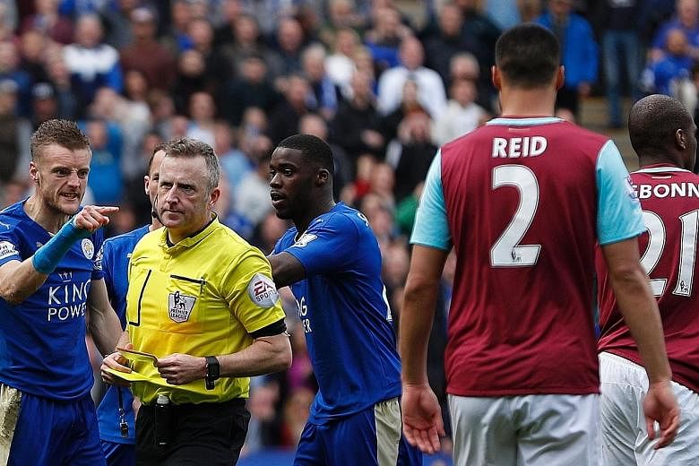 Leicester City's Jamie Vardy gave Jonathan Moss a piece of his mind after the referee showed the striker his second yellow card for simulation during the Foxes' draw with West Ham. Moss' controversial performance has increased the scrutiny on the cho