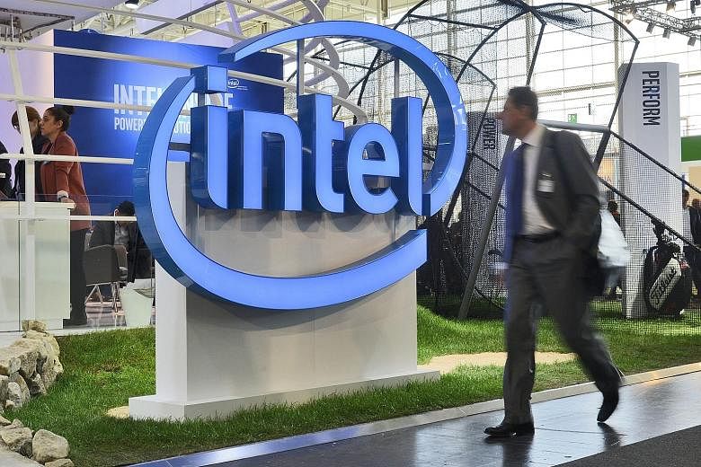 Intel Corp's stand at the CeBIT computer show in Germany last month. The chipmaker's job cutback - its deepest in a decade - is a radical step taken to move into new businesses and ease its dependence on the shrinking PC market.