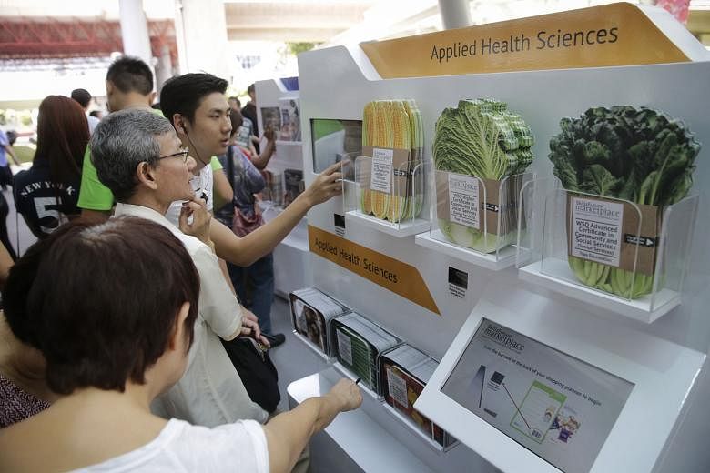 Visitors at the inaugural SkillsFuture roadshow at Westgate mall on Jan 9. SkillsFuture is everything we do to create a future that is different and better than today, says Acting Education Minister Ong Ye Kung. 