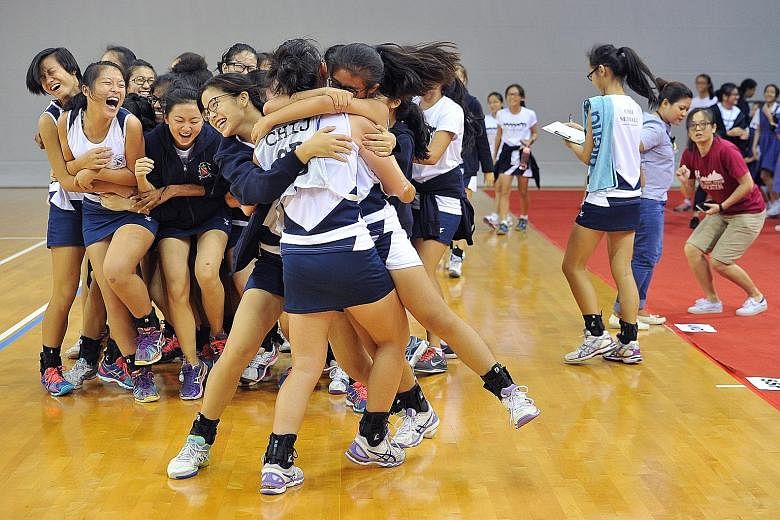 CHIJ Secondary's jubilant netball players celebrate after clinching both the B and C Division titles for the second year running. They beat Dunman Secondary 36-23 in the B Division final, and the Singapore Sports School 39-19 in the C Division final.