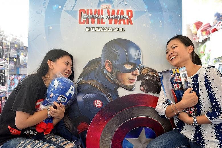 Quek siblings Gabriel, seven, and Hannah, 13, posing at the green-screen photobooth at Marvel's Captain America: Civil War Festival. Ms Aliefaini Pryanisa (left) and her aunt Fivi Mannell came from Jakarta to see the Team Cap cast.
