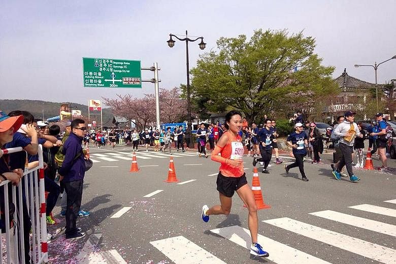Mok Ying Rong racing in the Gyeongju Cherry Blossom Half Marathon on April 9. She set a new national best time of 1:23:14 after winning the Women's Open category.