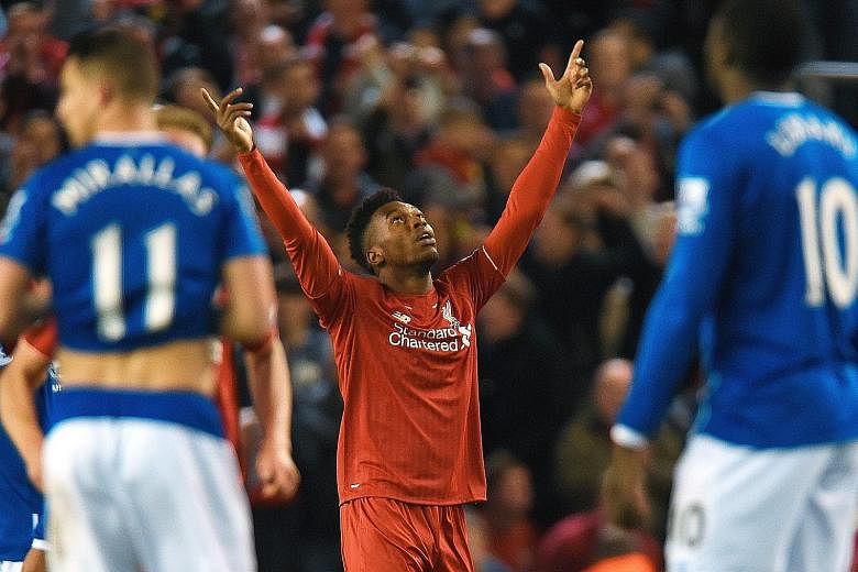 Daniel Sturridge celebrating after putting Liverpool three goals up against Everton. The Reds are on a rich run of form as Juergen Klopp's style starts to work magic.
