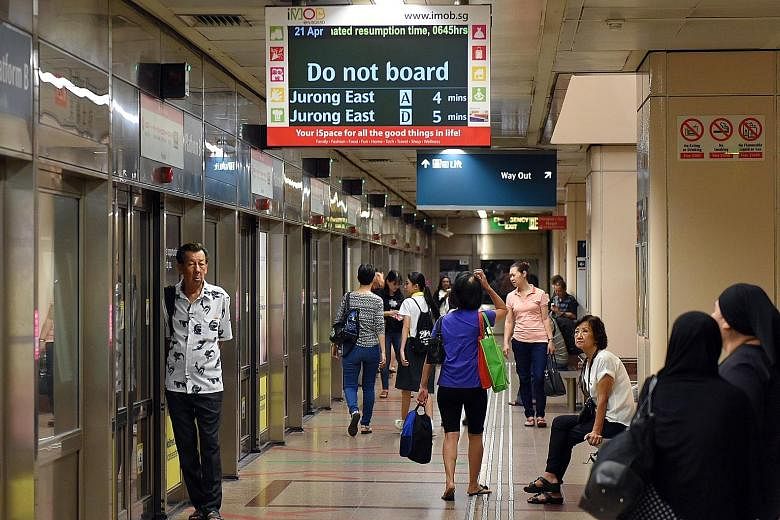 Passengers waiting for train services along the North-South Line to resume at Raffles Place station yesterday at 6.30am. Service was restored at around 6.50am. On the North East Line, service on part of the line was affected just after 11am, for abou