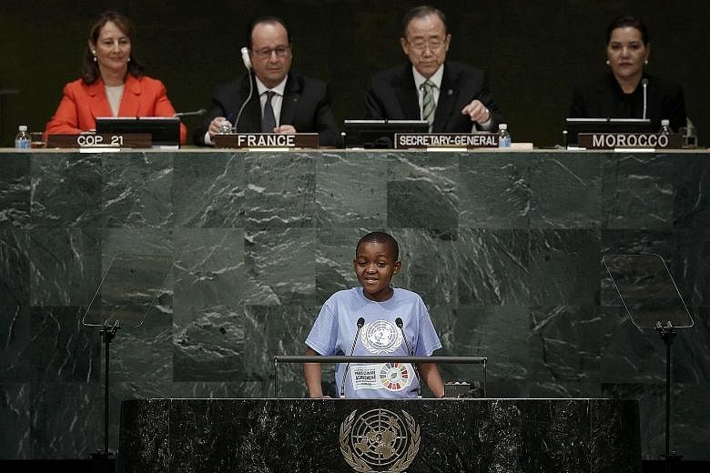 Youth representative Getrude Clement from Tanzania speaking at the opening ceremony of the Paris pact on climate change held at the UN in New York yesterday. Behind her are (from left) French Environment Minister Segolene Royal, who presides over the