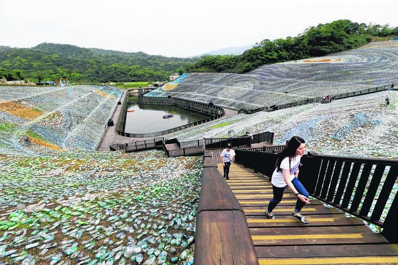 Visitors walking around "The Starry Paradise", a re-creation of Vincent Van Gogh's painting The Starry Night (left) made from plastic bottles at the Embrace Cultural and Creative Park at Keelung in northern Taiwan. About four million discarded plasti