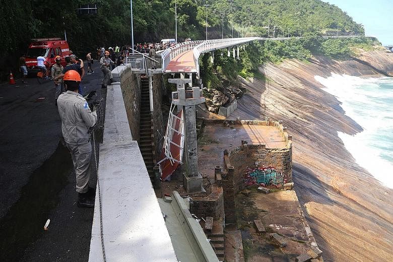 Emergency personnel at work after a section of a cycling path built for the upcoming Olympic Games 2016 in Rio de Janeiro, Brazil, collapsed earlier this week. Two people were killed when strong waves caused a 50m section of the path to collapse.