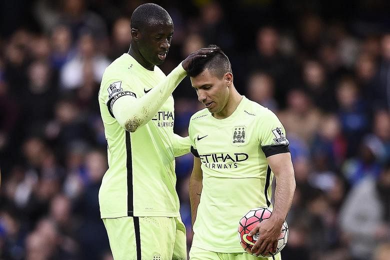 Yaya Toure celebrates with Sergio Aguero after the Argentinian scored all the goals in their 3-0 thrashing of Chelsea last Saturday at Stamford Bridge. His strike against Newcastle on Tuesday took him to 22 league goals this season, two behind Spurs'