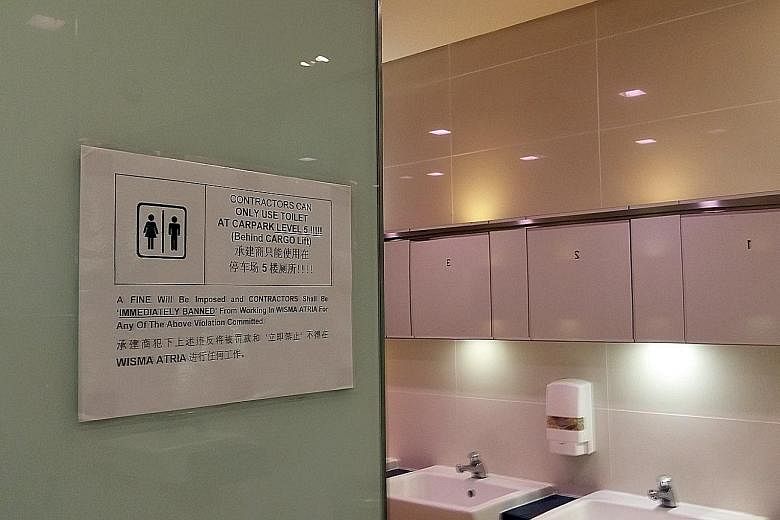 The mall's management has put up signs outside all the men's toilets. Construction workers who break the rule face a fine and will be barred from working in the mall. They are allowed to use only a toilet in the carpark on the fifth floor.