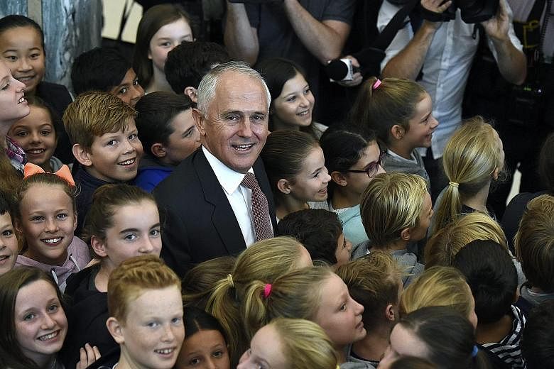 Mr Turnbull meeting schoolchildren after speaking to members of the Australian public services at Parliament House in Canberra on Wednesday. He remains the preferred prime minister by a healthy majority, according to a Fairfax-Ipsos poll, but his lea