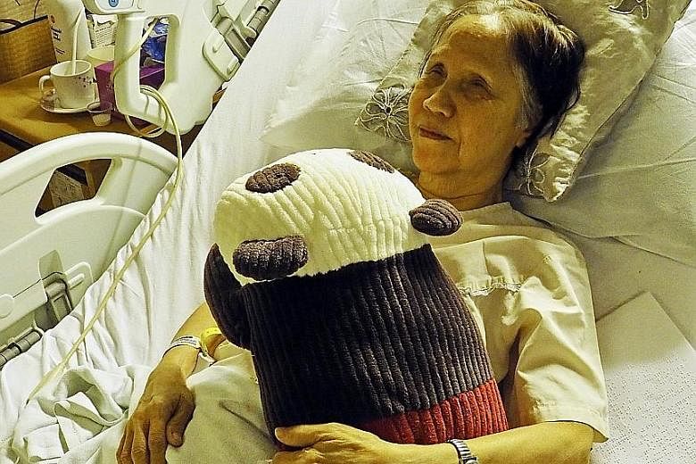 (Left) Ms Chan in Singapore General Hospital with her stuffed panda Popo and (above) in the award-winning film Be With Me. Her zest for life had inspired film-maker Eric Khoo.