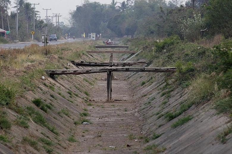 A dried-out canal in Nakhon Sawan province, north of Bangkok. Widespread drought and sweltering heat have left much of Thailand as well as Laos, Cambodia and Vietnam in dire need of water for both crops and residents.
