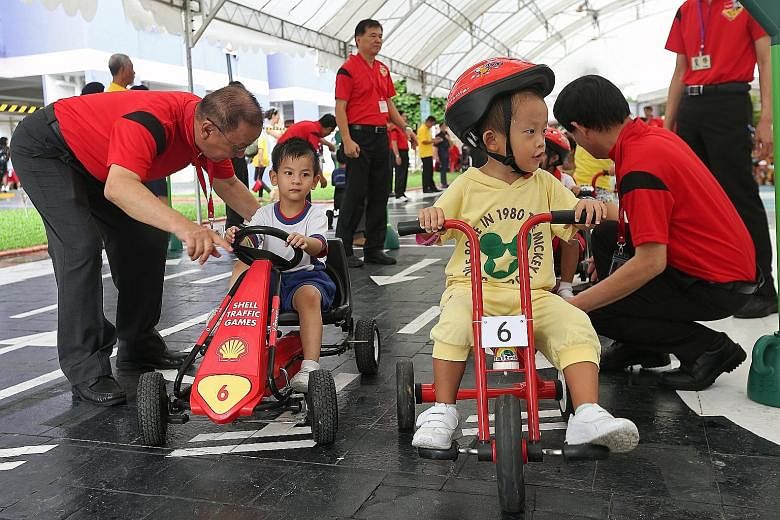 Children taking part in the road-safety event in Ang Mo Kio yesterday. The old and the young are among the most vulnerable road users.