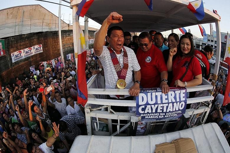 Mr Rodrigo Duterte whipping up the crowd during a campaign rally in Quezon City, east of Manila, on Saturday.