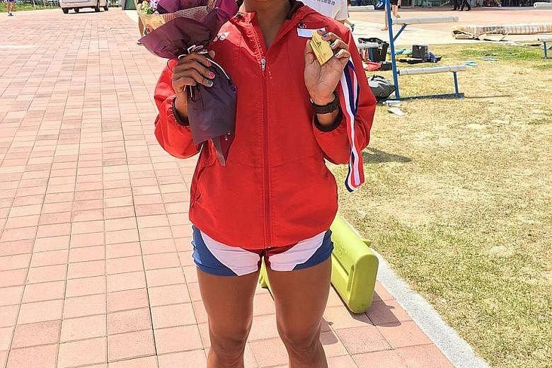 National rower Saiyidah Aisyah with her gold medal after winning the B final of the 2,000m women's single sculls at the Fisa Asia and Oceania Olympic Qualification Regatta to secure her Olympics berth.