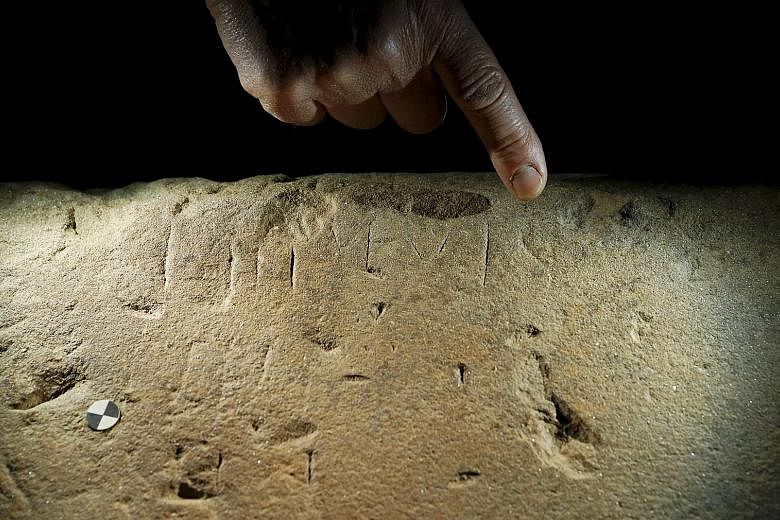 The inscriptions on this sandstone slab, excavated from a buried temple in Tuscany, may help archaeologists uncover more details about the ancient Etruscan civilisation which flourished in central Italy 2,500 years ago.