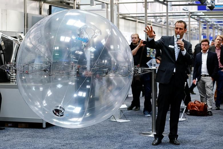 The ultra-light FreeMotionHandling indoor flying object of German automation technology company Festo drawing attention at the Hanover Fair in Germany on Monday. Festo has combined gripping and flying in a single future helium-filled concept object t