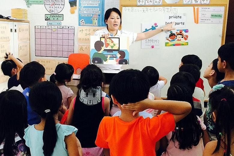 A staff member of Singapore Children's Society conducting a KidzLive session. The society runs such sessions at pre-schools for free to teach five- and six-year-olds "body safety skills".
