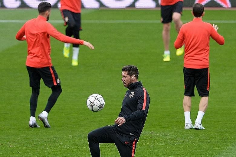 Manager Diego Simeone (in black) is juggling Atletico Madrid's challenge on two fronts. The La Liga contenders take on Bayern Munich in the Champions League semi-finals first-leg today.