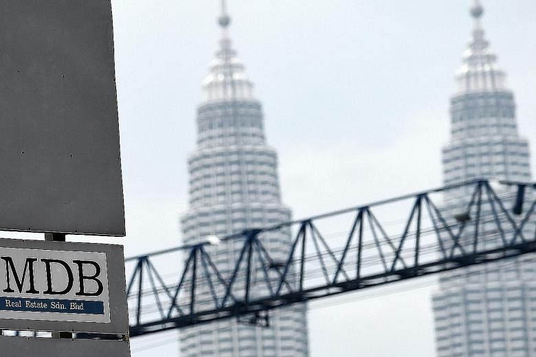 1MDB says it had defaulted on a US$1.75 billion (S$2.37 billion) bond issue, triggering cross-defaults on locally issued Islamic bonds totalling RM7.4 billion (S$2.6 billion).