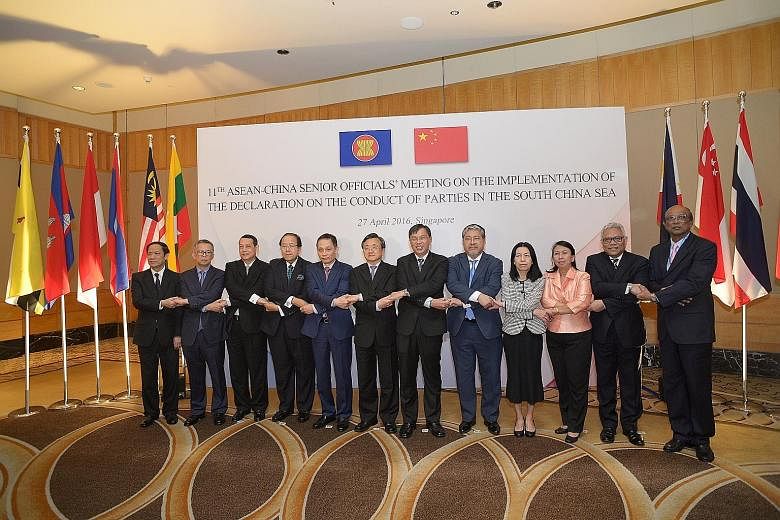 Senior officials from China and Asean who met here yesterday: (from left) Laos' Minister in the Government's Office Alounkeo Kittikhoun; Malaysia's Foreign Affairs Ministry Secretary-General Othman Hashim; Myanmar's Foreign Affairs Ministry Permanent