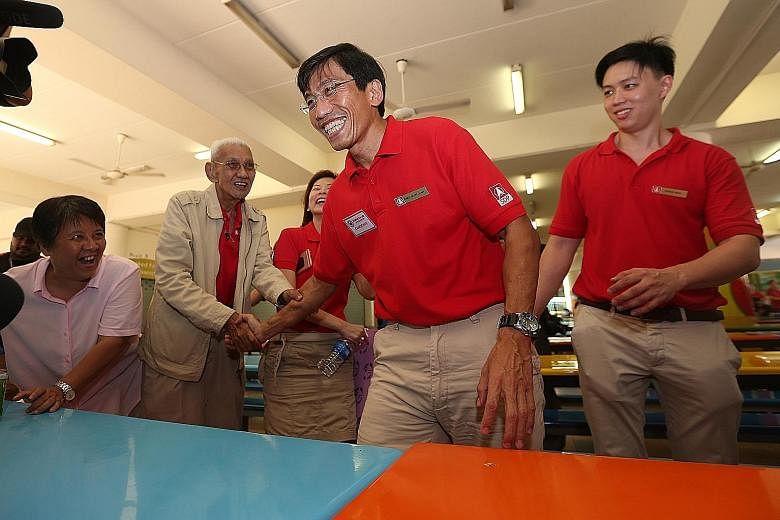 Dr Chee (centre) after a press conference yesterday at Keming Primary School, the nomination centre. Earlier, he said that SDP will make Bukit Batok a model town and "the envy of Singapore". At the conference, he said that apart from rallies, he will