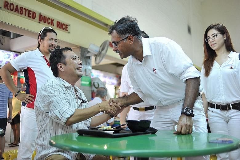 Mr Murali meeting a Bukit Batok resident on Nomination Day yesterday. He says the groups he is most intent on helping are the jobless, the elderly and children from lower-income or broken homes.