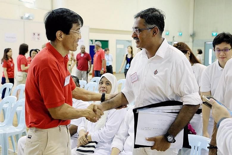 SDP chief Chee Soon Juan greets PAP's Mr Murali Pillai at the nomination centre at Keming Primary School. Both candidates kicked off the race yesterday with promises to make the constituency shine but a disagreement arose on how they would do so.