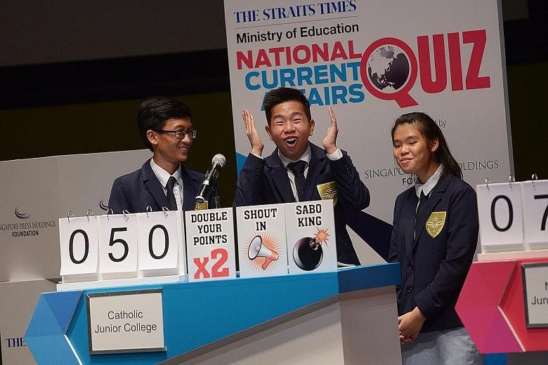 CJC students (from left) Andi, Jose and Shi Yen tackling a question during the third round of the Big Quiz before emerging victorious yesterday.
