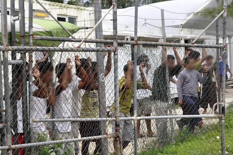 Asylum seekers fenced in at the Australian-funded regional processing centre on Manus island in Papua New Guinea. The PNG Supreme Court on Tuesday ordered the closure of the camp, saying that holding the refugees there was both unconstitutional and i