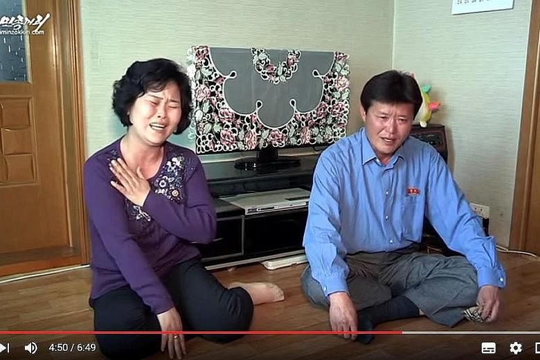 A screengrab of a video showing the parents of waitress So Gyong A. Pyongyang claims Ms So and 11 other waitresses were tricked into defecting when they went to work at a restaurant in China.