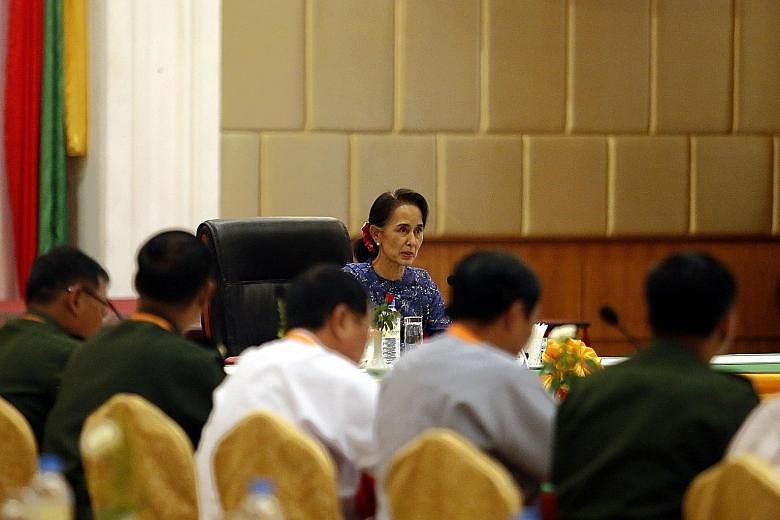 Ms Suu Kyi addressing the committee that monitors the National Ceasefire Accord on Wednesday.