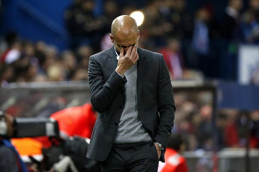 Bayern Munich's head coach Pep Guardiola (above) shows the anguish of the 1-0 defeat in the first leg of the Champions League semi- final against Atletico Madrid on Wednesday. The game's only goal was a sublime solo effort by Saul Niguez (second from