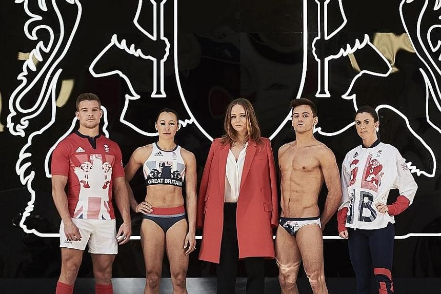 Above: British fashion designer Stella McCartney (centre) is flanked by (from left) rugby captain Tom Mitchell, heptathlete Jessica Ennis-Hill, diver Tom Daley and Paralympian Olivia Breen at the London launch of Team Great Britain's official kit for