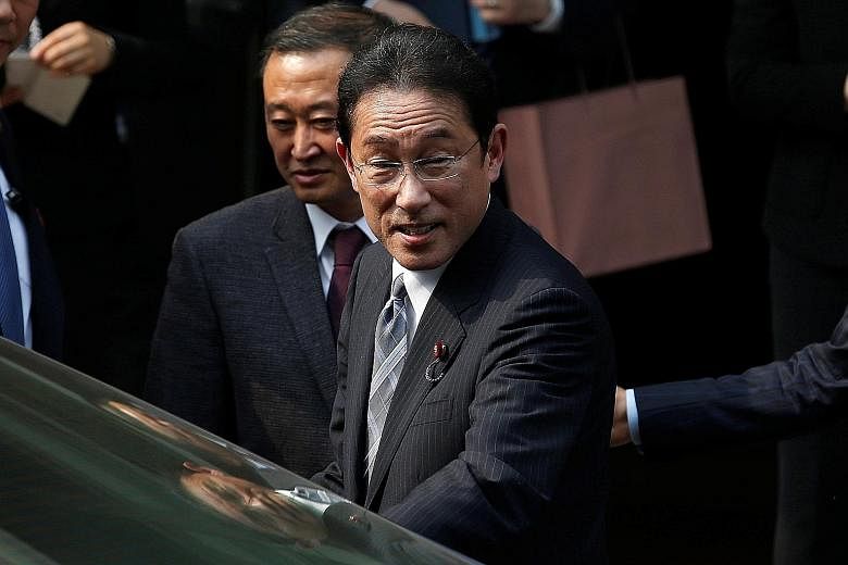 Mr Kishida leaving Hiroshima University's Beijing Research Centre at Capital Normal University in Beijing after a visit yesterday. He is reportedly seeking to make preparations for a summit between Japanese Premier Shinzo Abe and Chinese President Xi