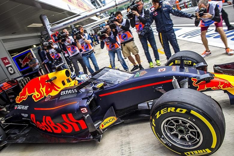 Daniel Ricciardo driving his Red Bull out of the pits to test the new cockpit canopy during the first practice session at the Sochi Autodrom circuit in Russia. "The first impression seems okay," the Australian said. "It doesn't really block any more 